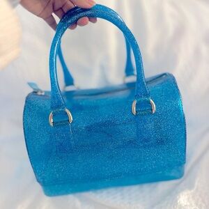 Speedy style bag blue shimmer clear plastic.